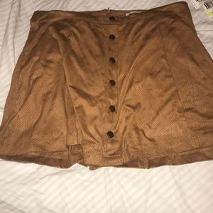 Faux suede skirt. With front buttons for detail.